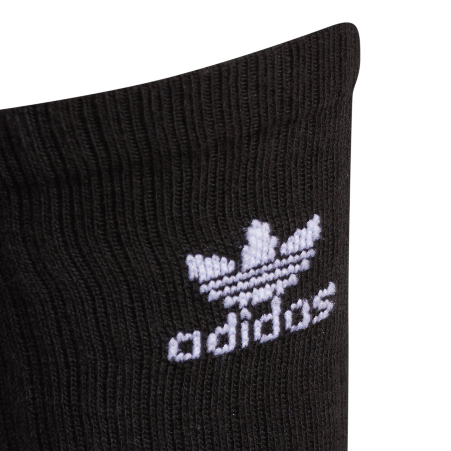 Close-up of adidas socks showing ribbed crew design and Trefoil logo