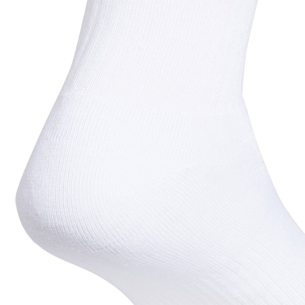 Adidas crew socks displayed in a casual setting, emphasizing comfort for daily wear.