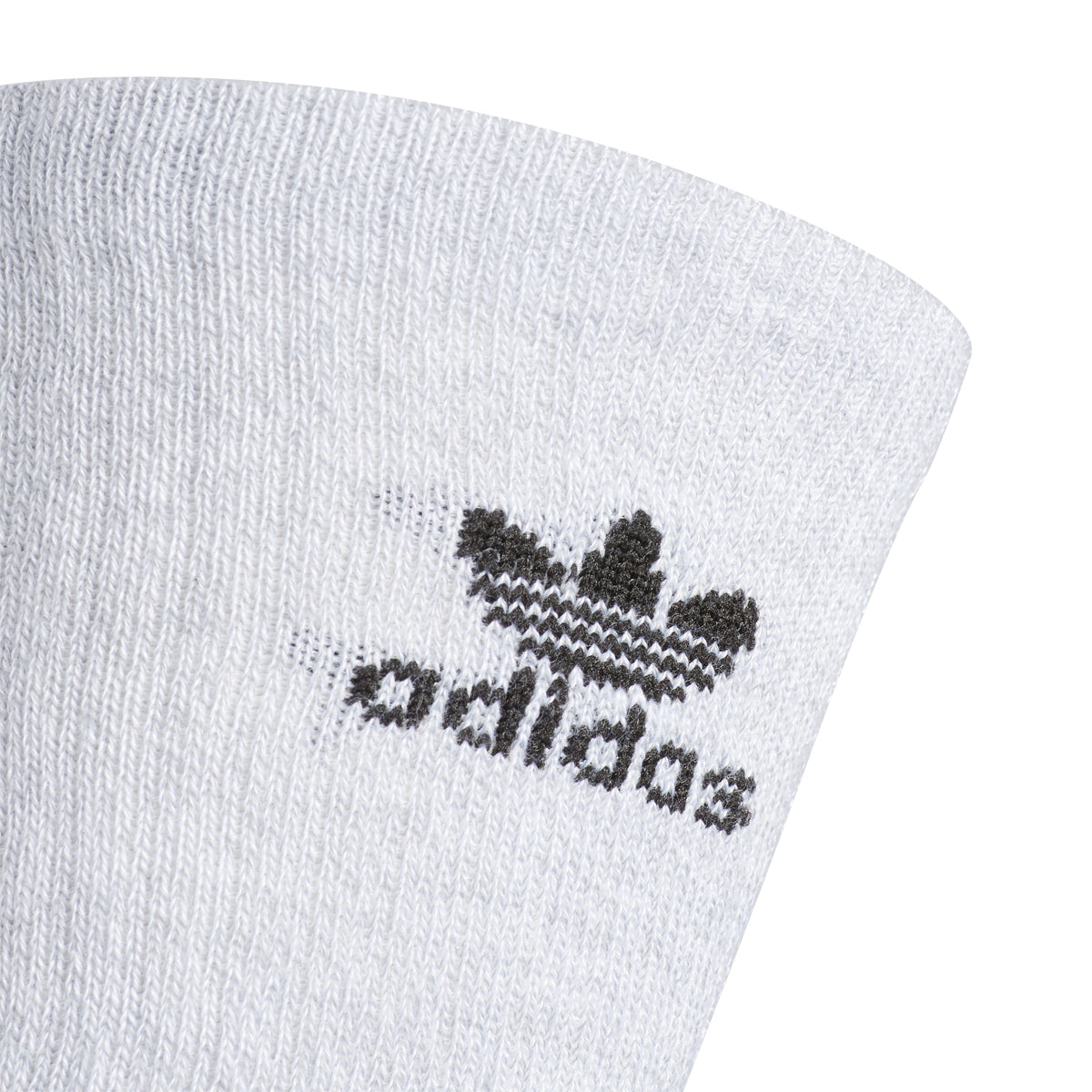 Adidas crew socks in a variety of colors for kids, showcasing their cushioned design.