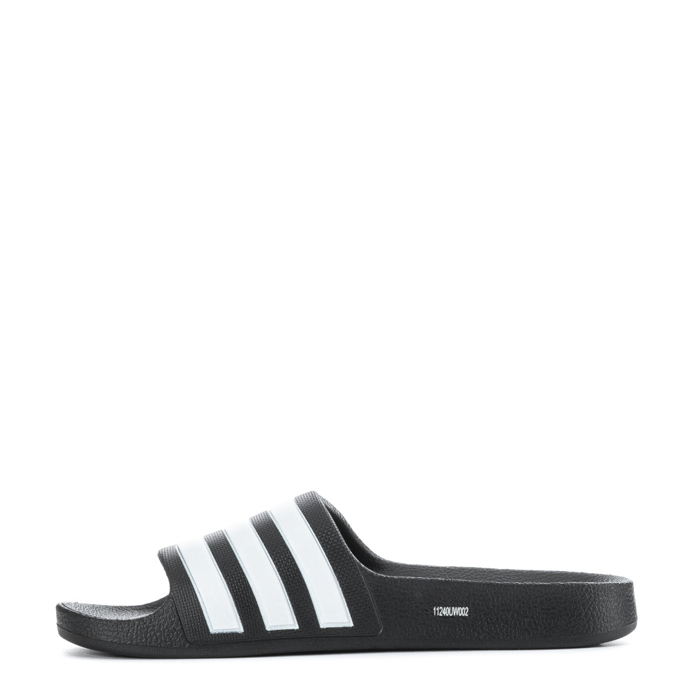Close-up of the molded EVA upper of Adidas Aqua Comfort Youth Slides, highlighting the stylish 3-Stripes.
