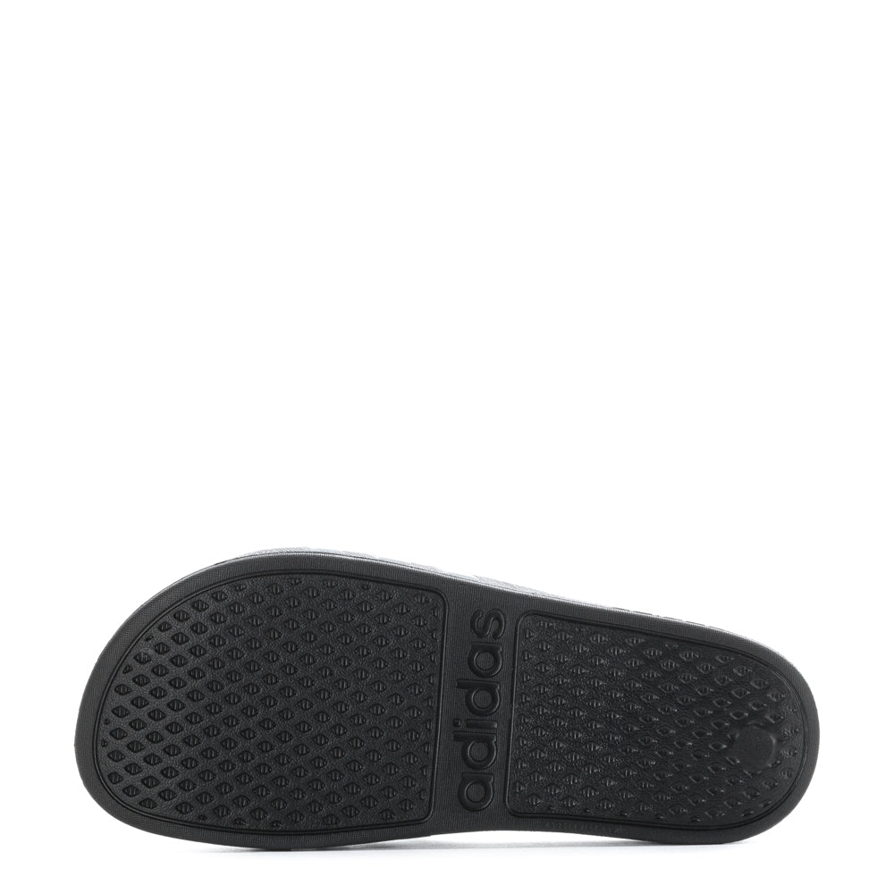 Close-up of the molded EVA upper of Adidas Aqua Comfort Youth Slides, highlighting the stylish 3-Stripes.