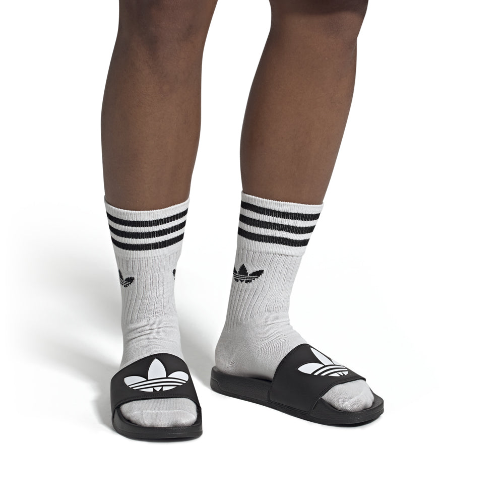 Side view of lightweight adidas slides ideal for summer casual wear