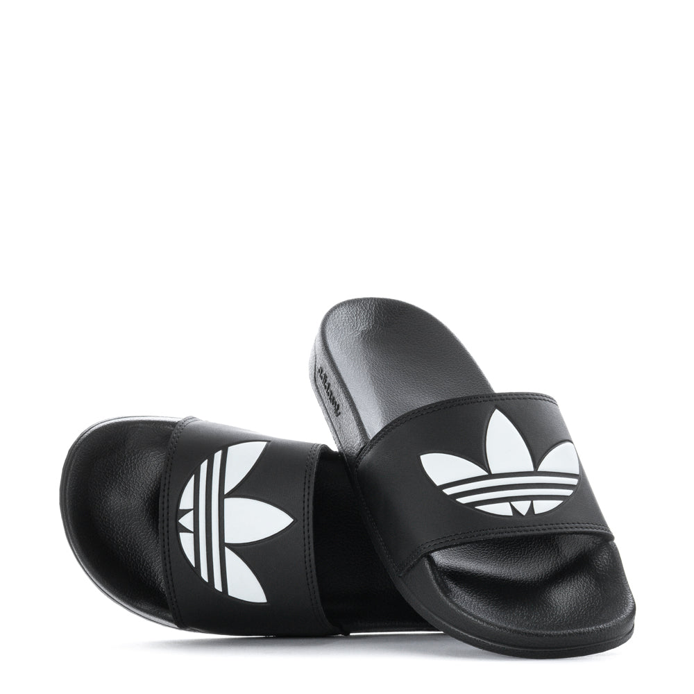 Close-up of adidas Adilette Lite mens slides showing the cushioned footbed and synthetic strap