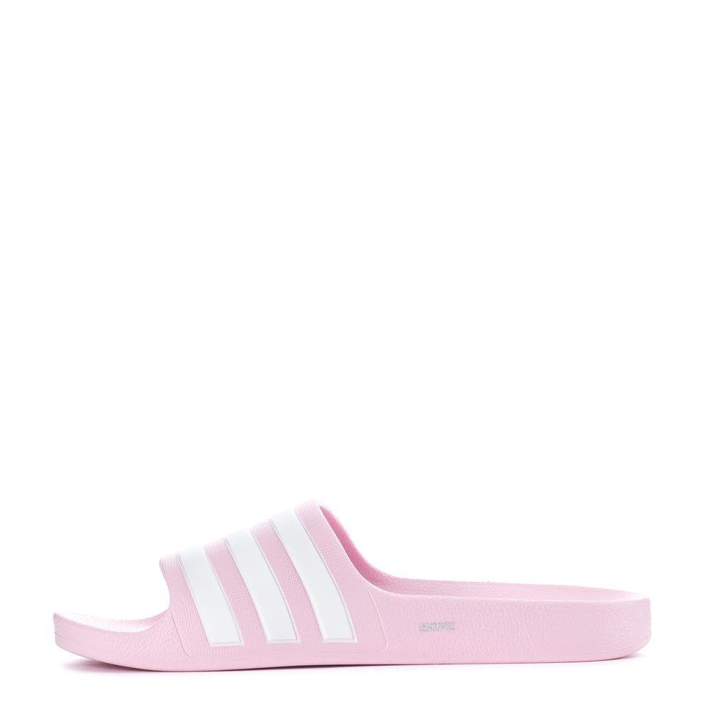 Close-up of the soft Cloudfoam footbed of Adidas youth slides, highlighting comfort and support.