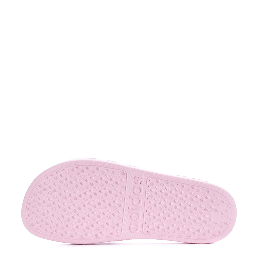 Close-up of the soft Cloudfoam footbed of Adidas youth slides, highlighting comfort and support.