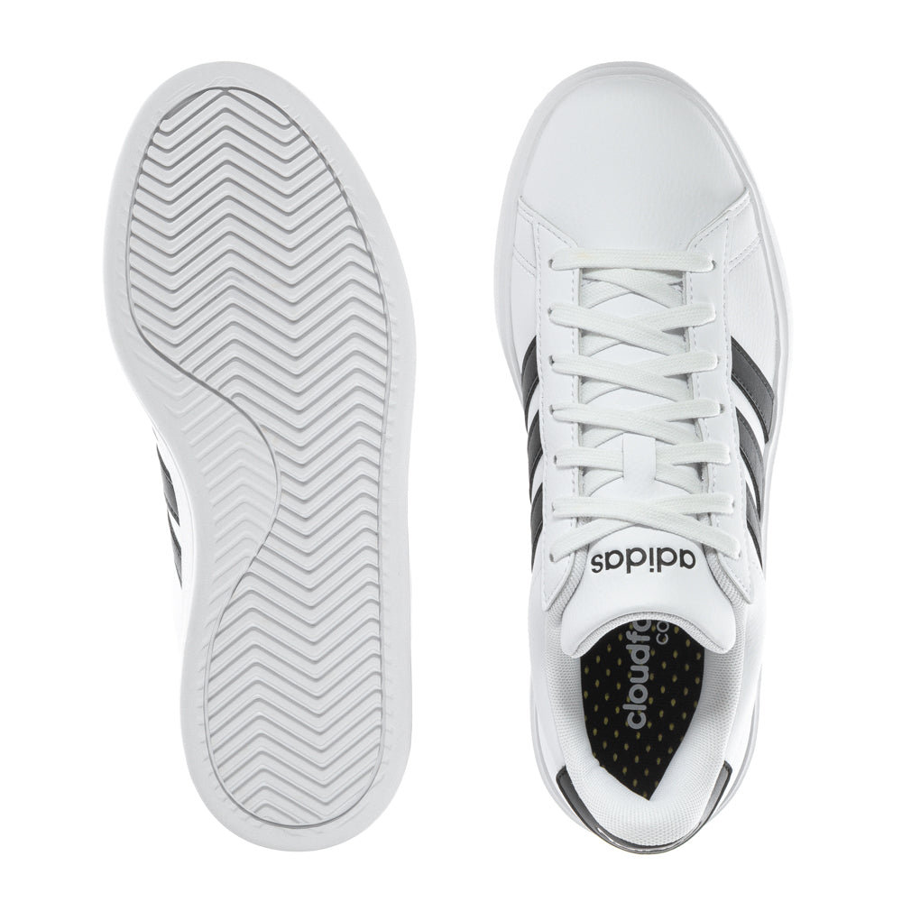 Side view of Adidas Grand Court womens sneakers showcasing their classic design and Cloudfoam Comfort.