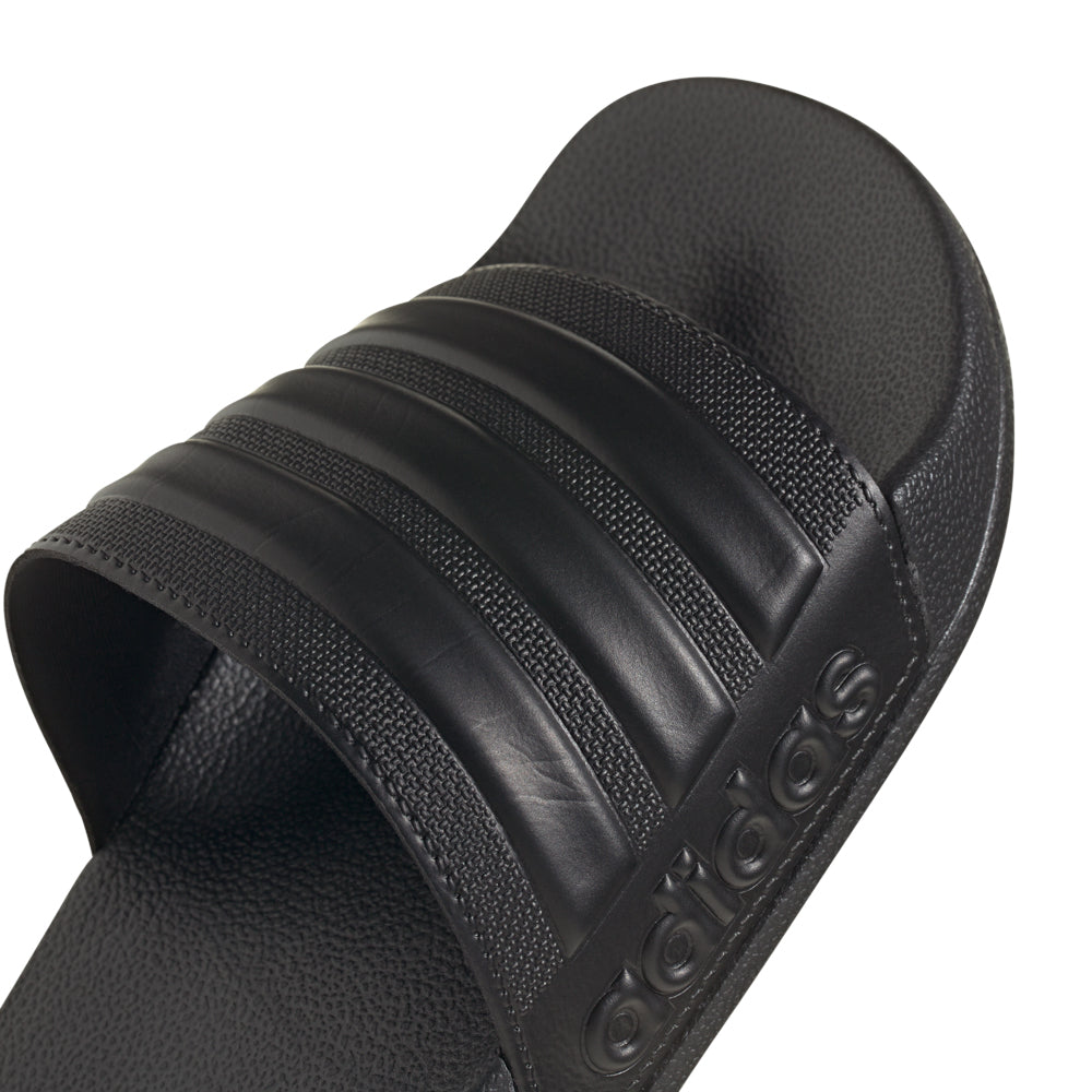 Person wearing comfortable mens pool slides after swimming