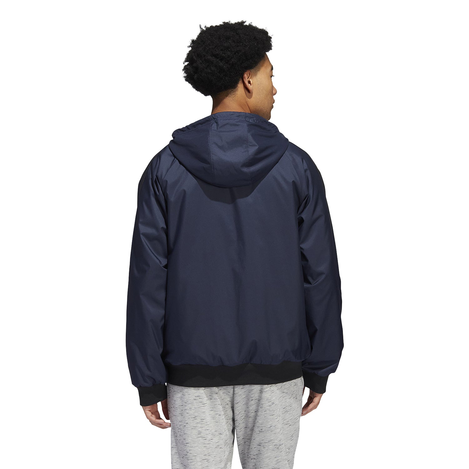 Close-up of adidas jacket with fitted collar and logo