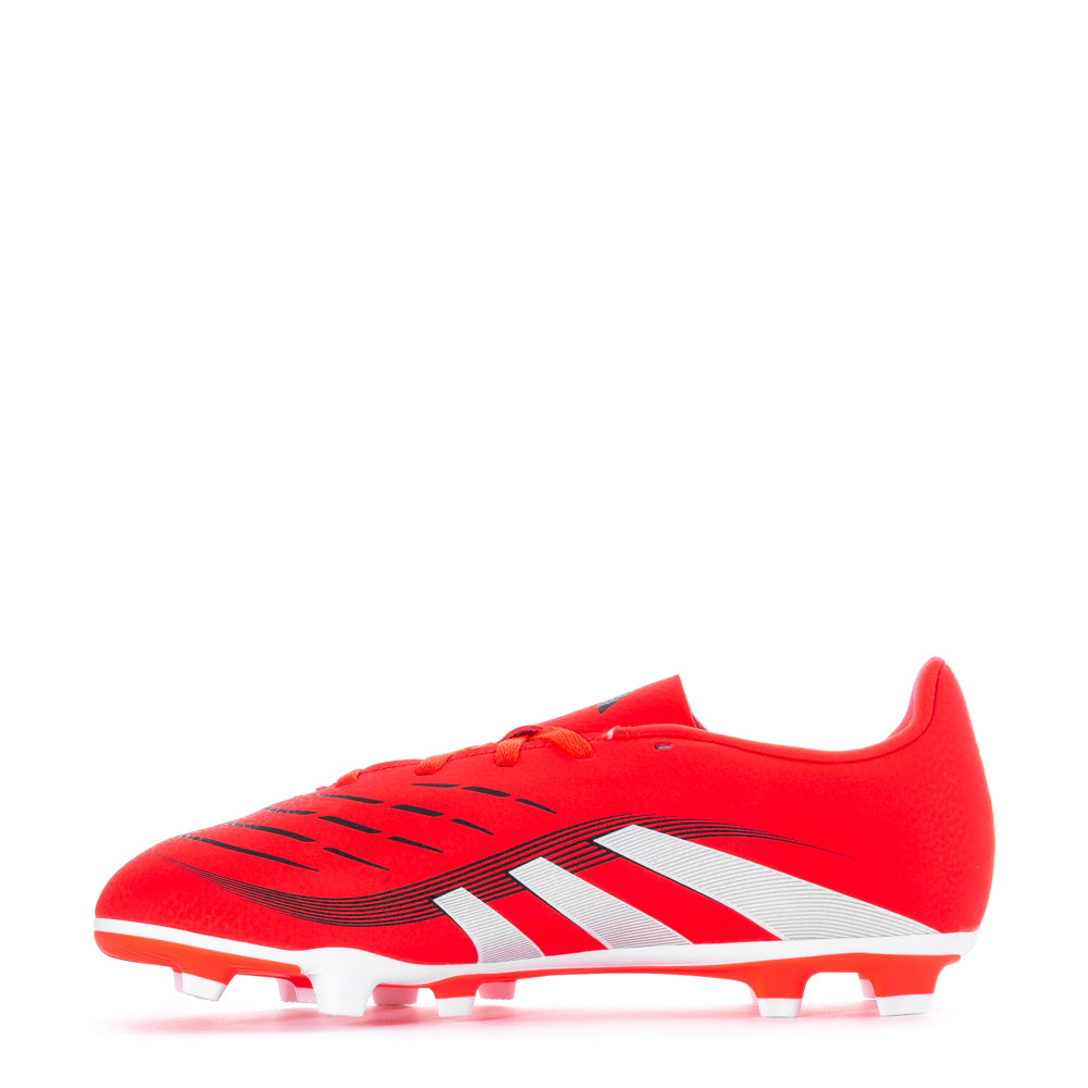 Side view of soccer cleats on grass field demonstrating aggressive cleat pattern