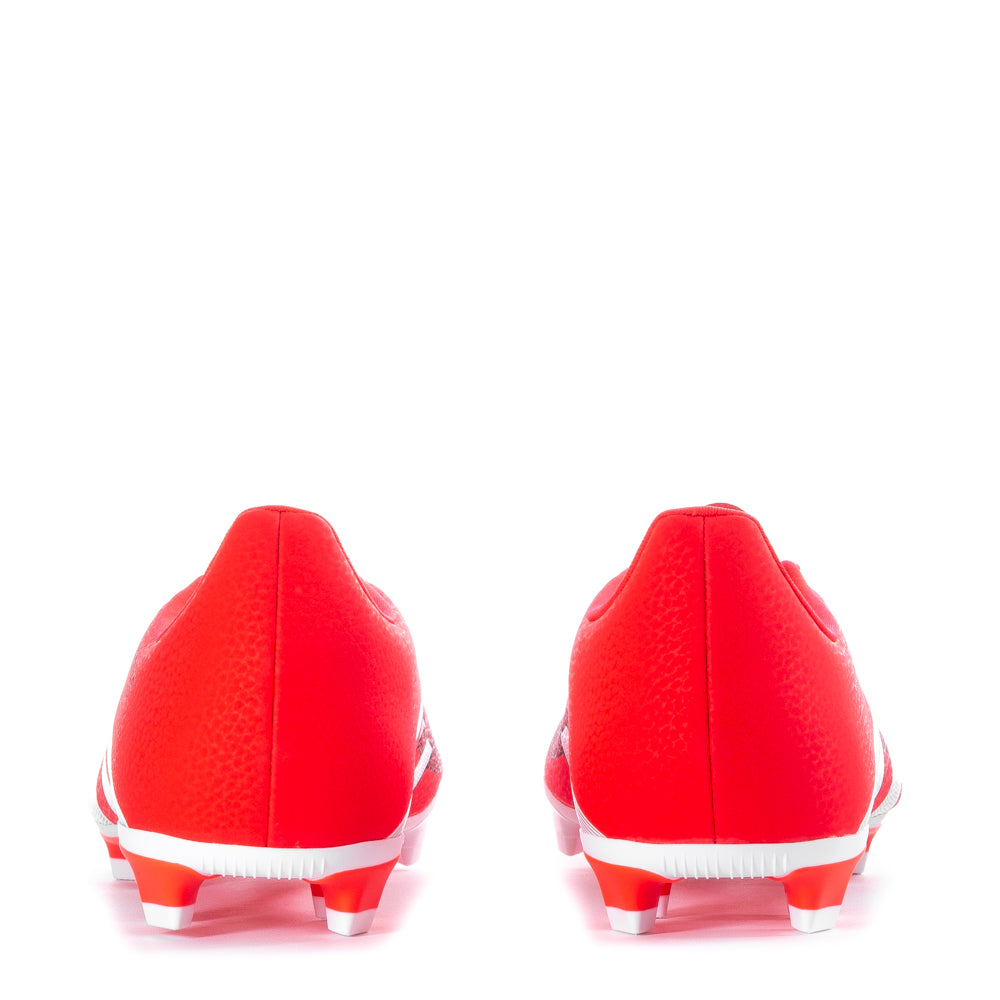 Side view of soccer cleats on grass field demonstrating aggressive cleat pattern