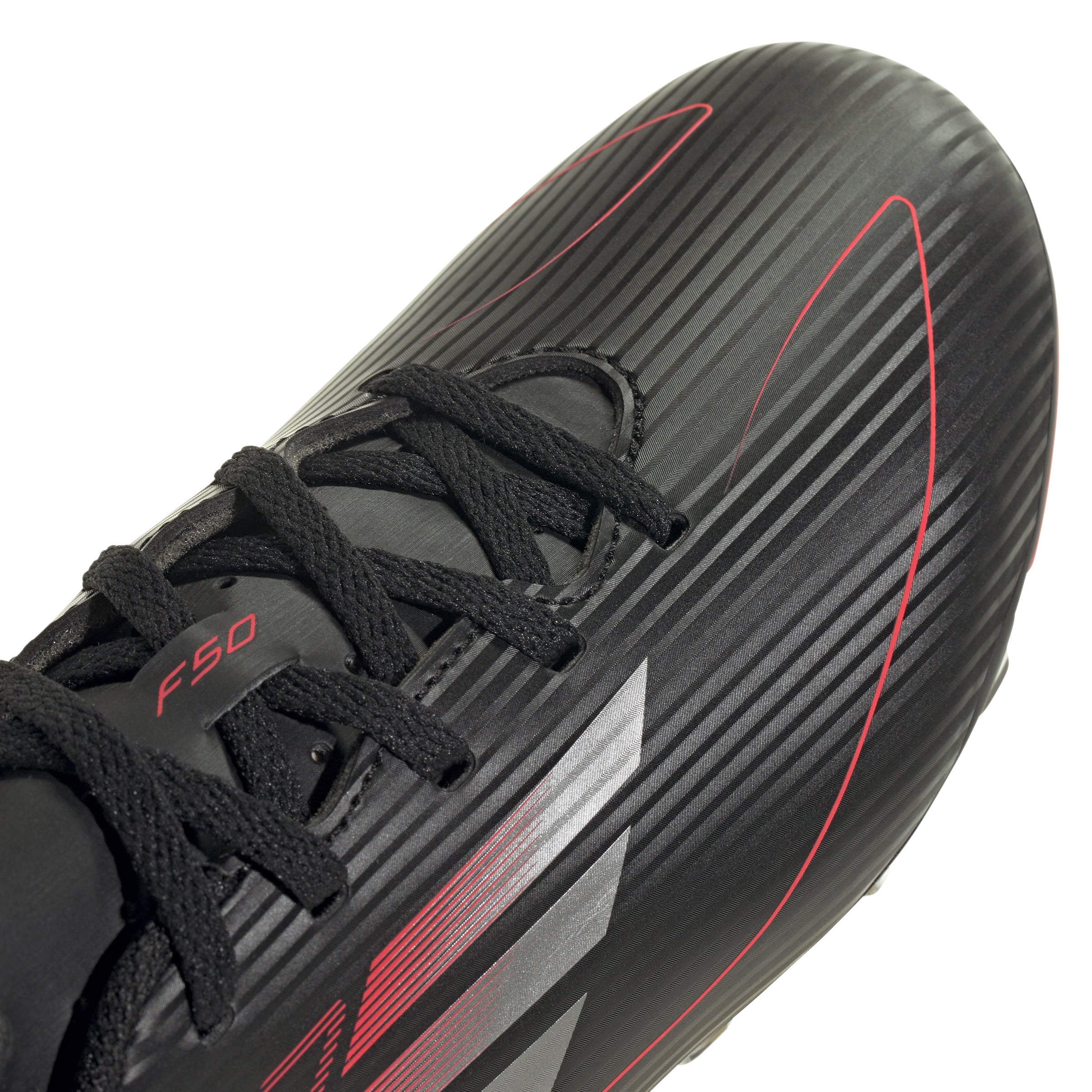 Side view of the slip-on Adidas F50 Club FG Youth Cleats, demonstrating ease of use for kids.