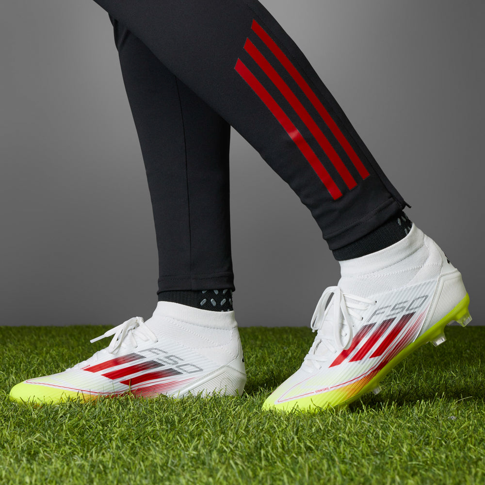 Close-up of the sticky mudguard on adidas womens soccer shoes for muddy grass