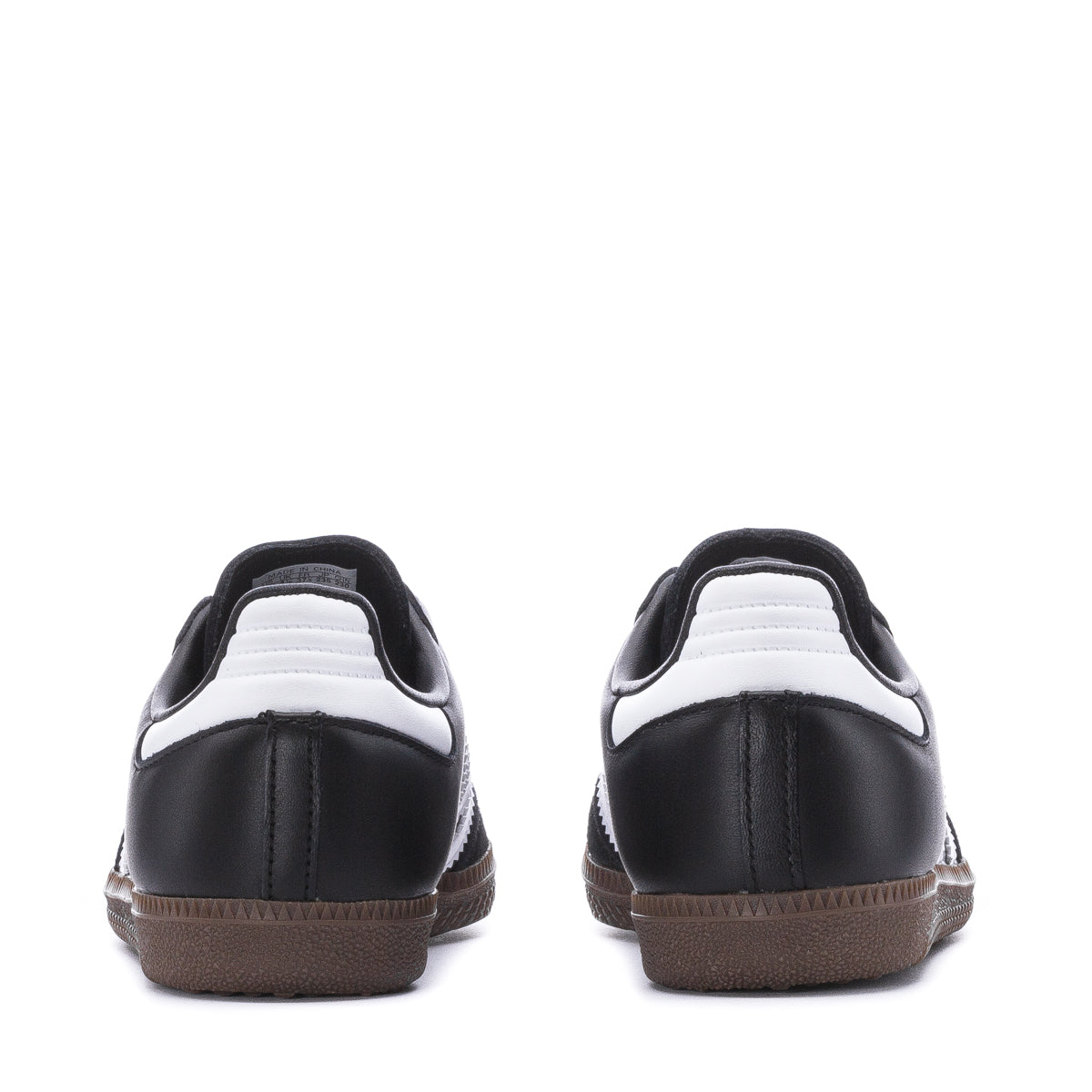 Side angle of gum sole flexing on playground blacktop—perfect kids sneakers for sports