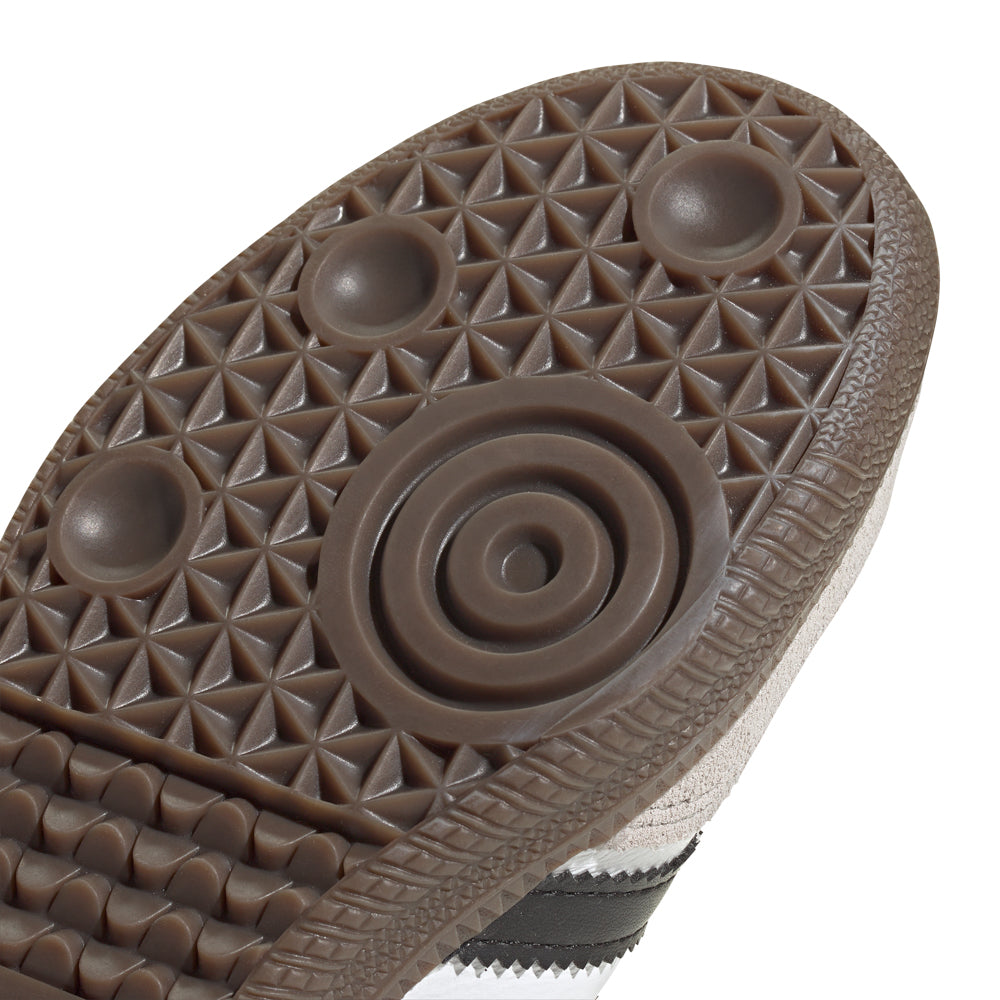 Side view of Samba OG kids sneakers highlighting stylish design and supportive sole