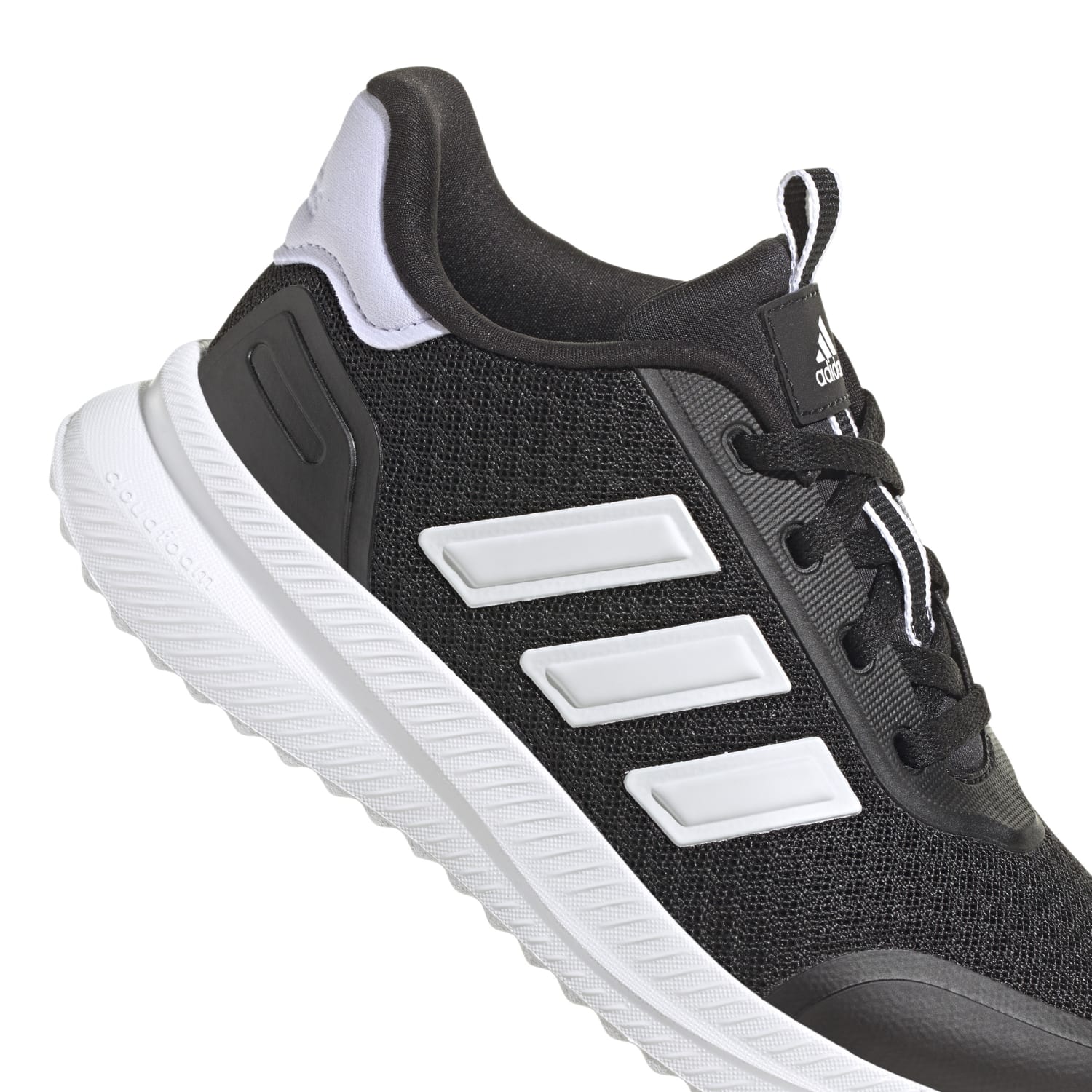 Action shot of kids wearing X_PLR PATH Youth Sneakers during gym class.