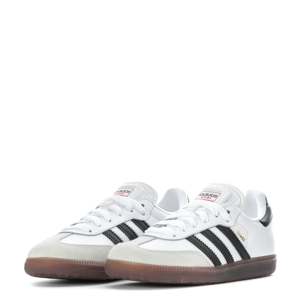 Child playing inside wearing classic kids soccer shoes with non-marking outsole