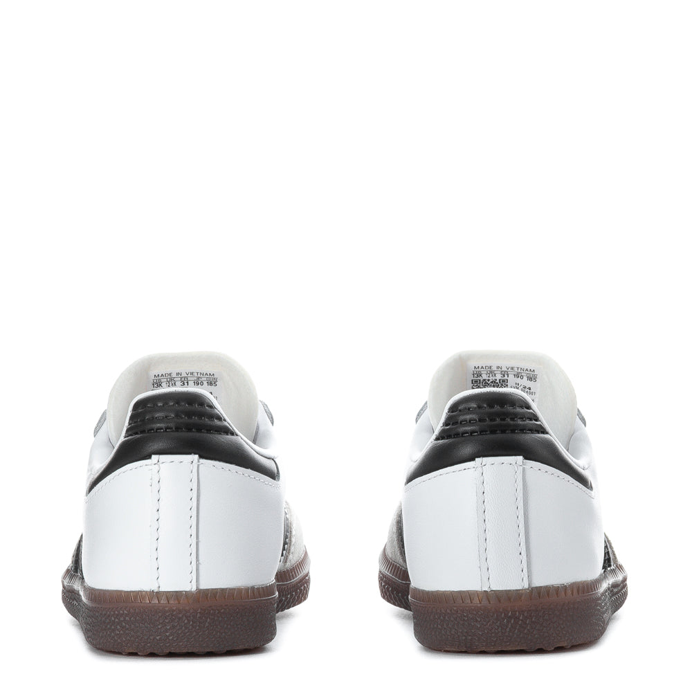 Close-up of Adidas Samba shoes showing suede toe overlay and serrated 3-Stripes