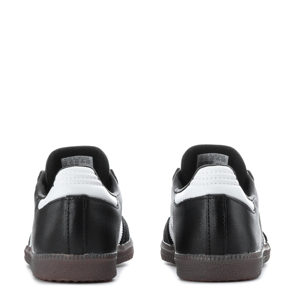 Close-up of the Adidas Samba Classic shoes highlighting the leather upper and cushioning.