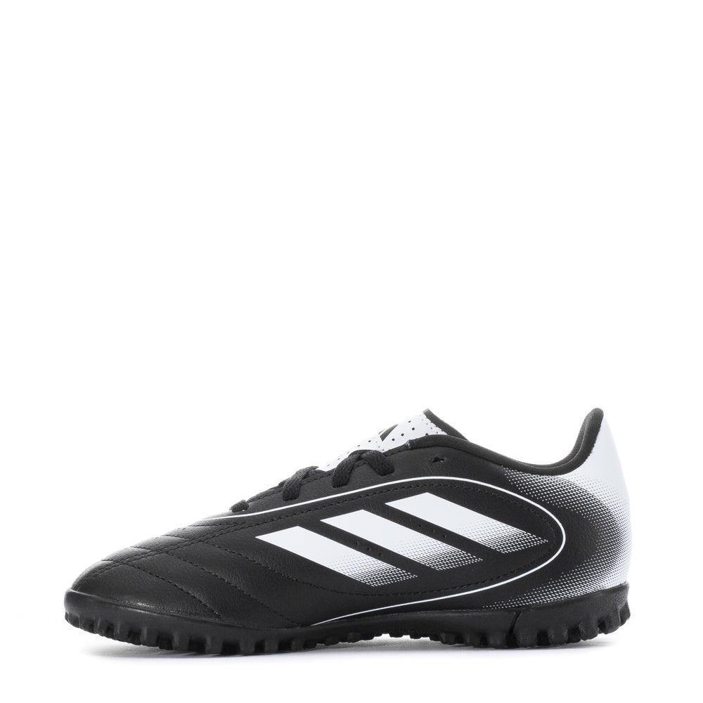Kids wearing Adidas Goletto IX turf shoes while playing soccer on a grassy field.