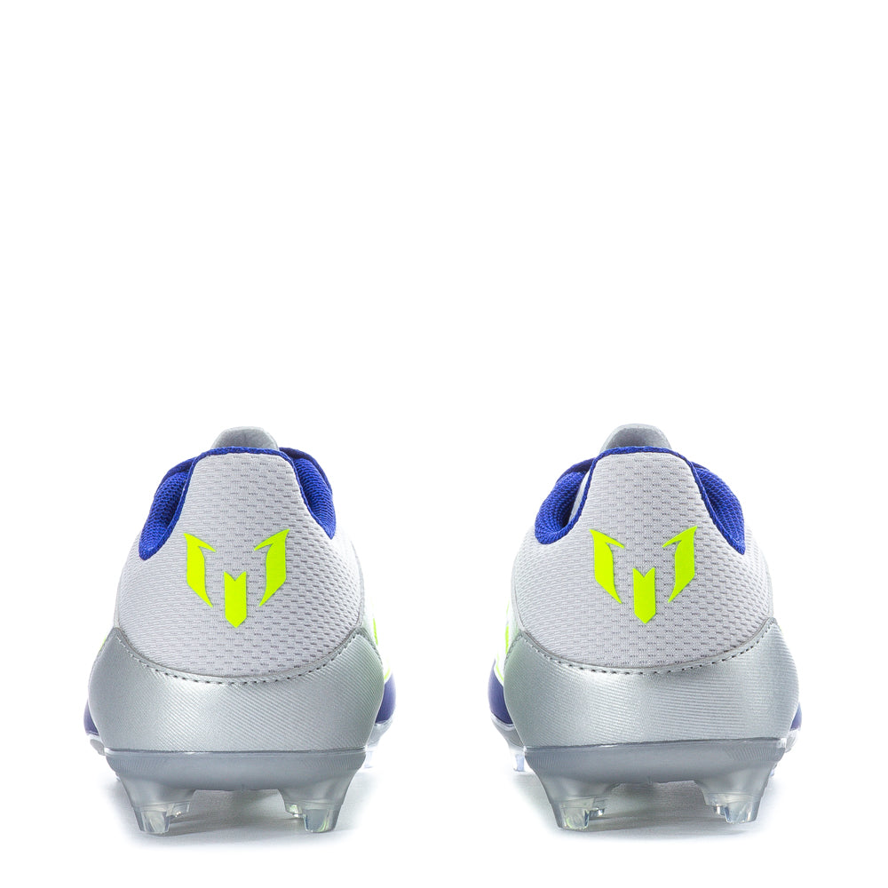 Close-up of the F50 League FG Messi youth football boots on grass field
