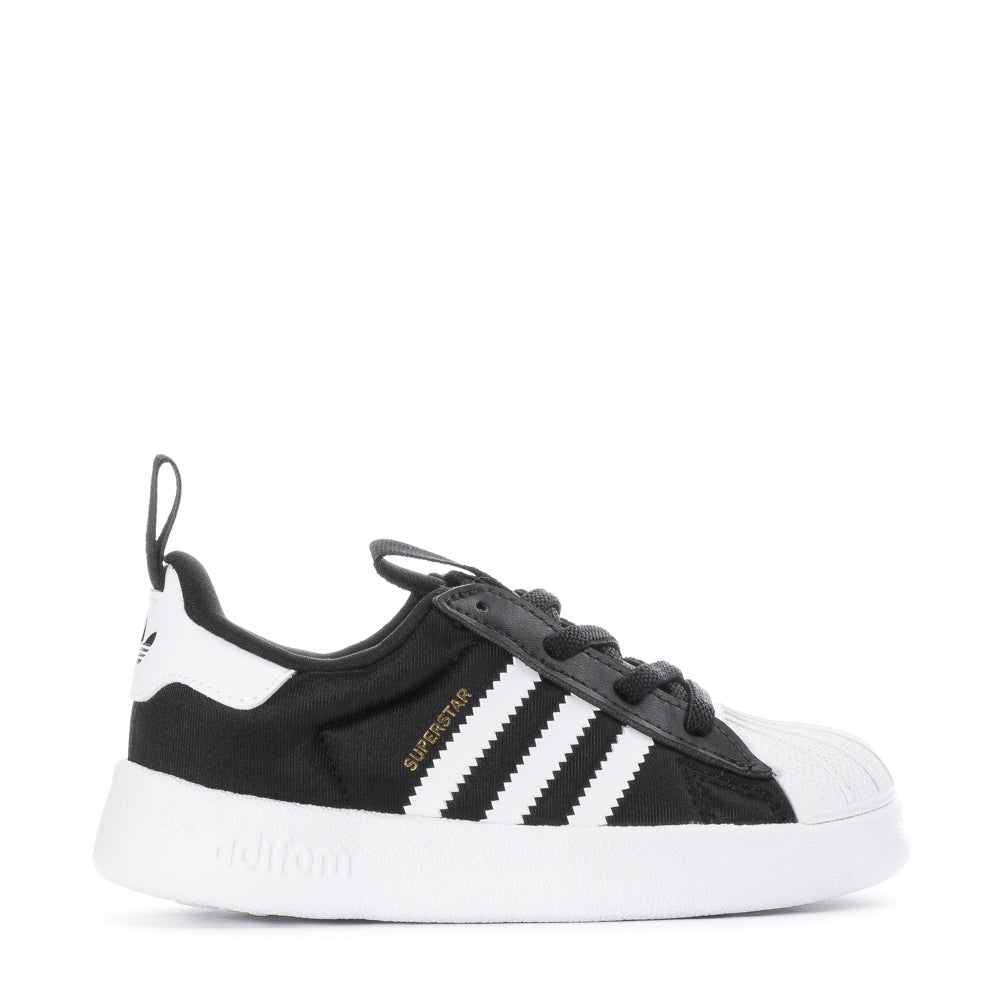 Side view of adidas toddler sneakers showing cushioned collar and rubber shell toe