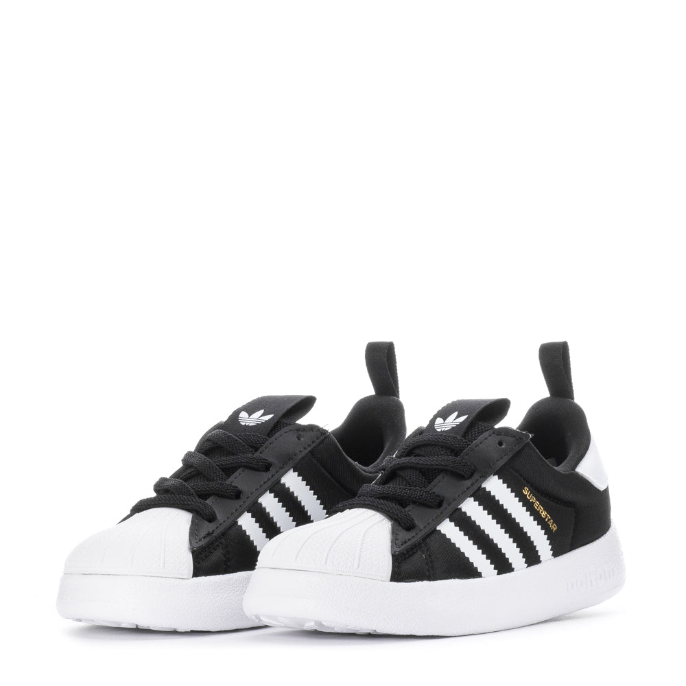 Lifestyle image of toddler wearing adidas Superstar 360 sneakers with casual outfit