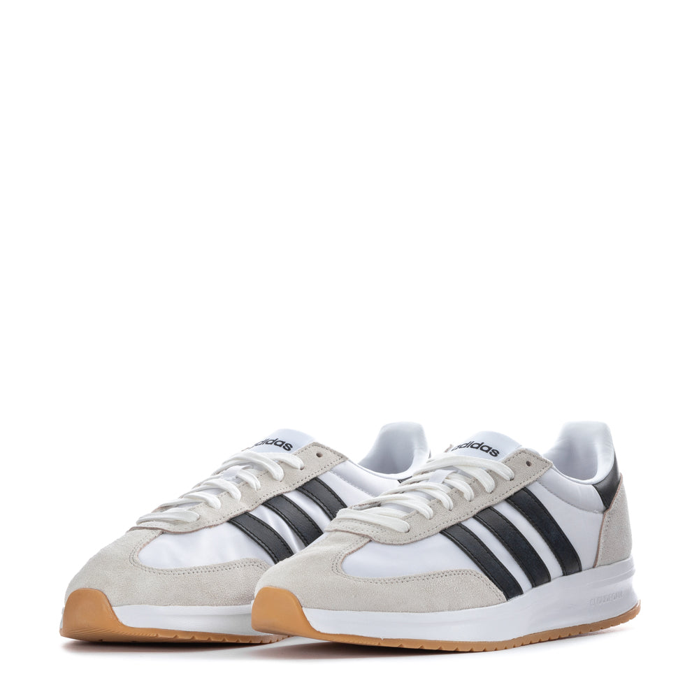 Adidas Run 70s 2.0 sneakers on a running track, demonstrating their performance in action.