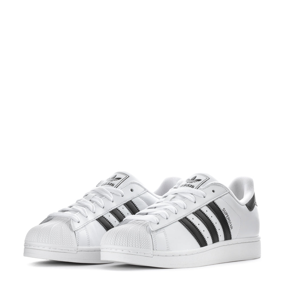 Fashionable man wearing adidas Superstar II leather sneakers for everyday casual wear