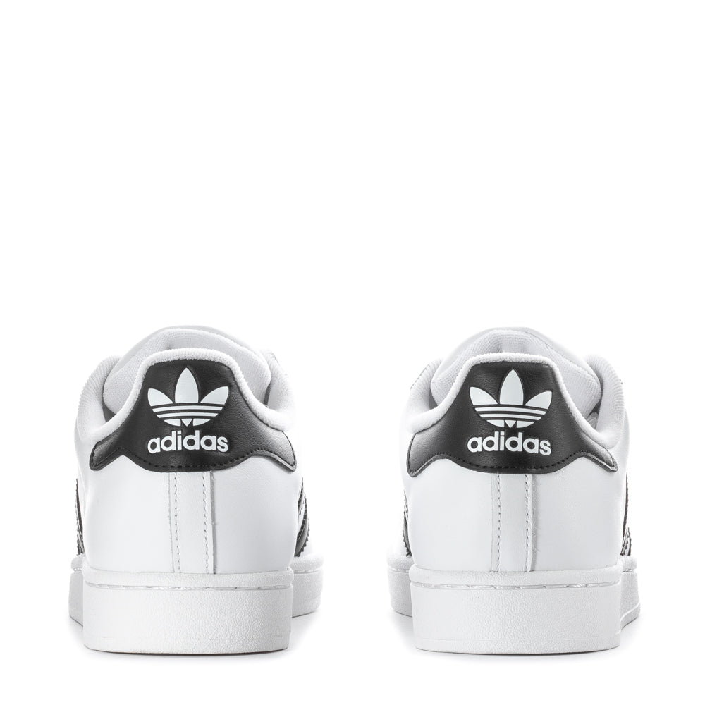 Side view of mens adidas Superstar sneakers highlighting the signature 3-Stripes and padded collar