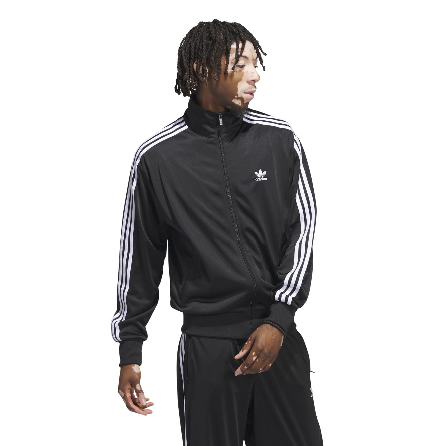 Close-up of the zip-up front and fitted cuffs of a mens track jacket