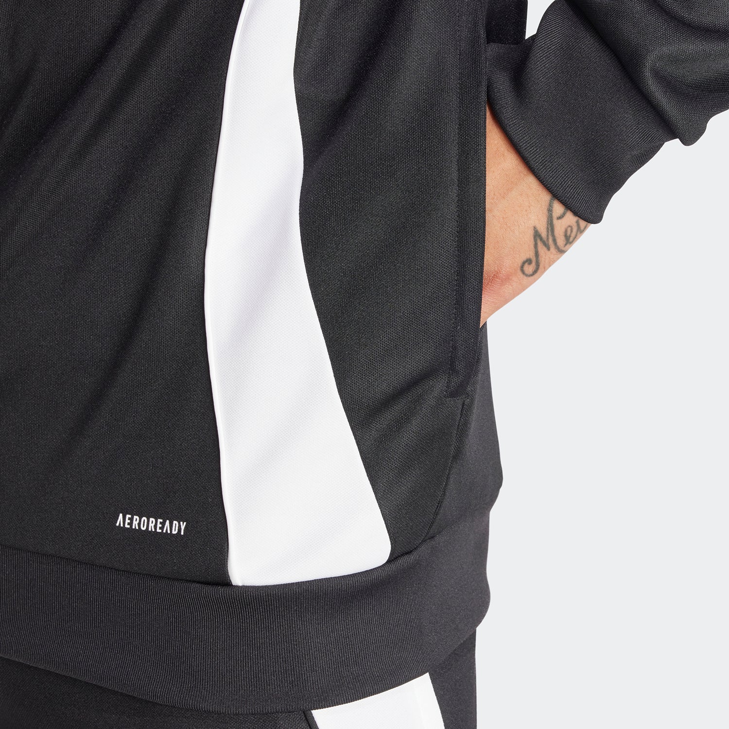 Close-up shot highlighting moisture-wicking fabric texture and zipper garage