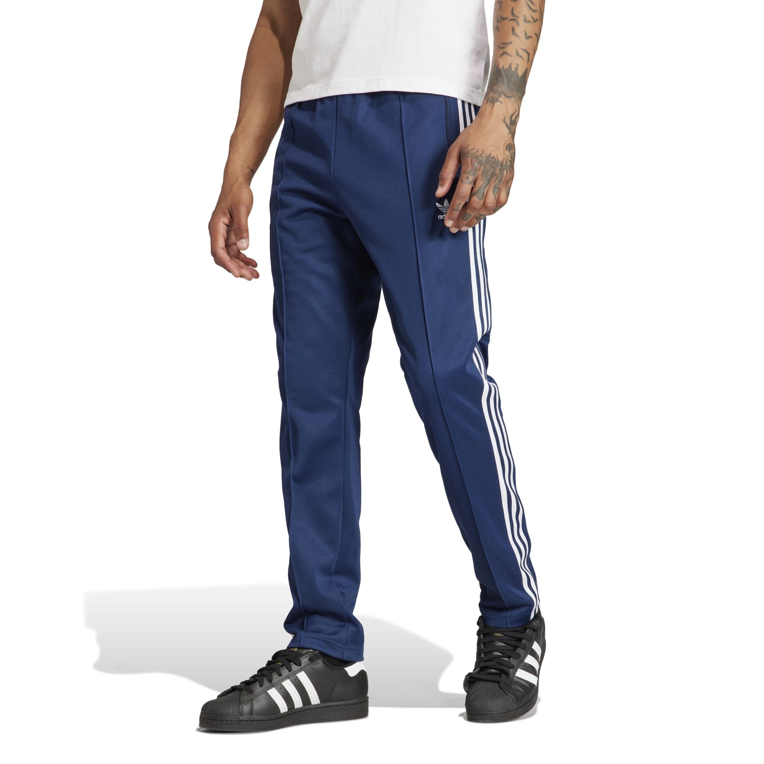 Front view of recycled athletic wear adidas track pants with elastic waistband and pockets