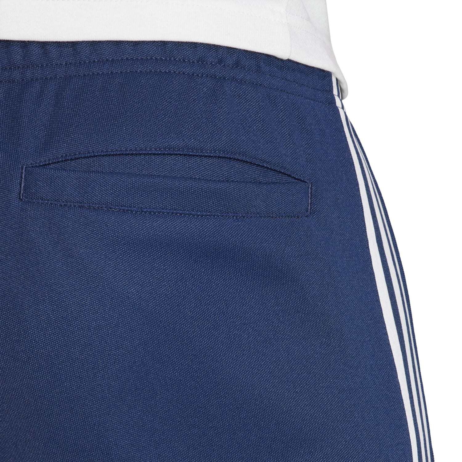 Front view of recycled athletic wear adidas track pants with elastic waistband and pockets