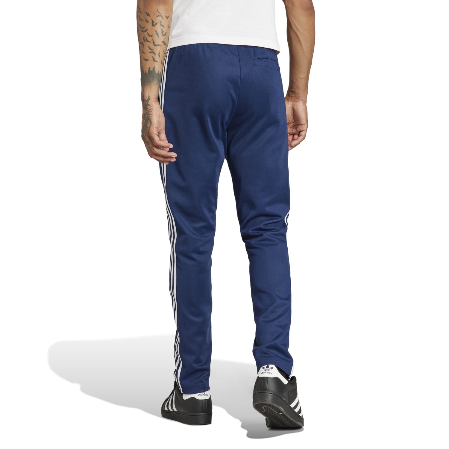 Side angle of retro adidas mens pants highlighting the stylish fit and zip features