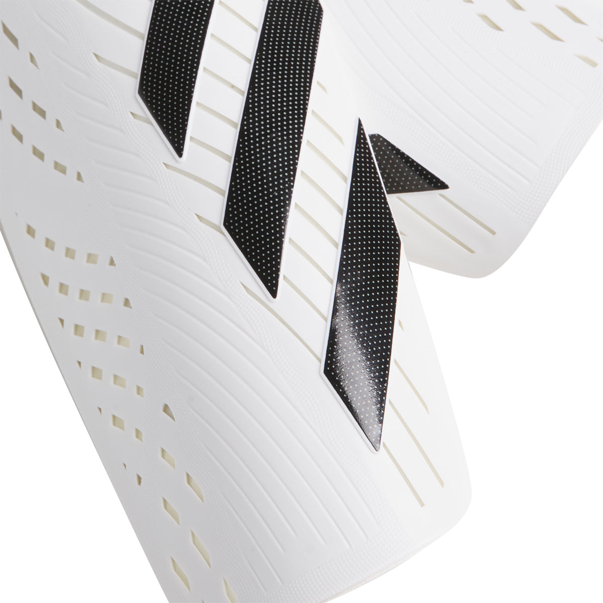 Close-up of breathable EVA padding and ventilated sleeve on Adidas shin guards