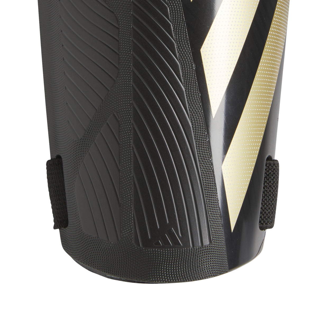 Youth soccer player wearing breathable adidas Tiro strap-on shin guards
