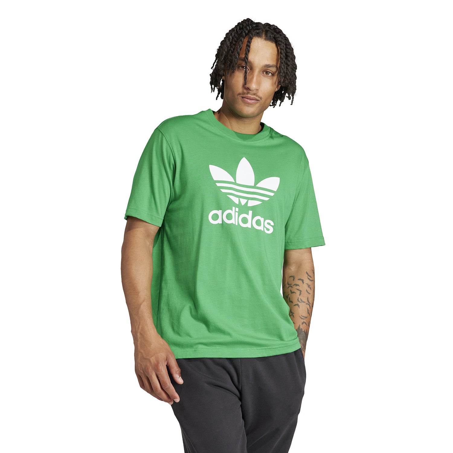 Close-up of the embroidered Trefoil logo on the Adidas cotton logo tee