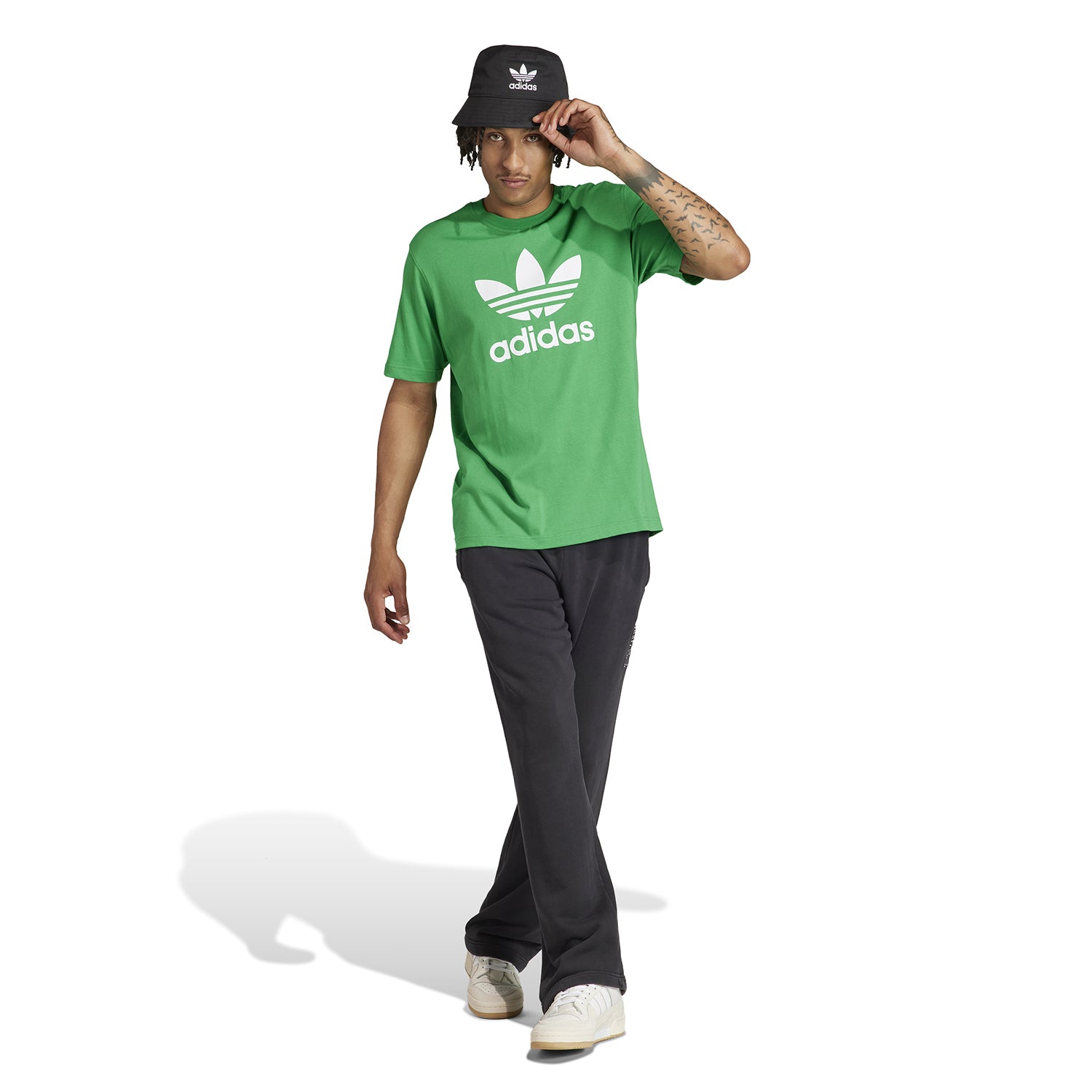 Model wearing the Adidas Trefoil T-shirt paired with shorts for casual look