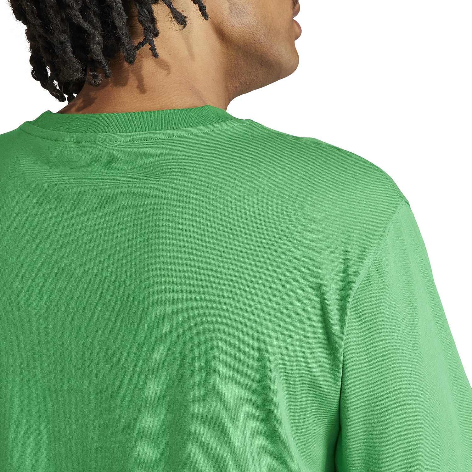 Close-up of the embroidered Trefoil logo on the Adidas cotton logo tee