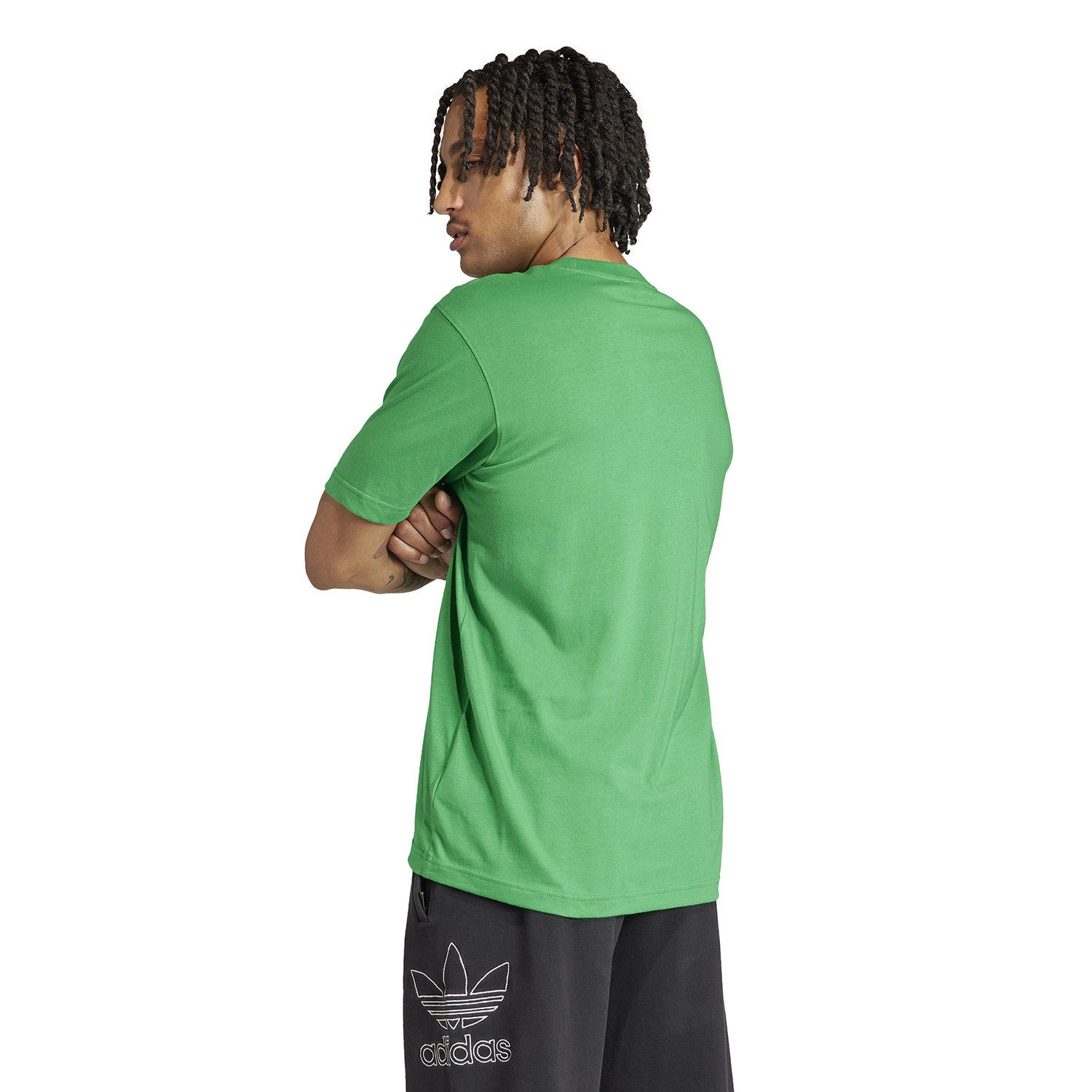 Model wearing the Adidas Trefoil T-shirt paired with shorts for casual look