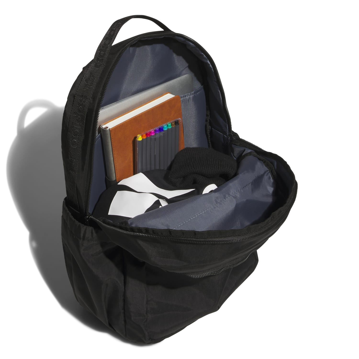 Side profile of travel backpack with orange interior peeking out and water-bottle pocket expanded