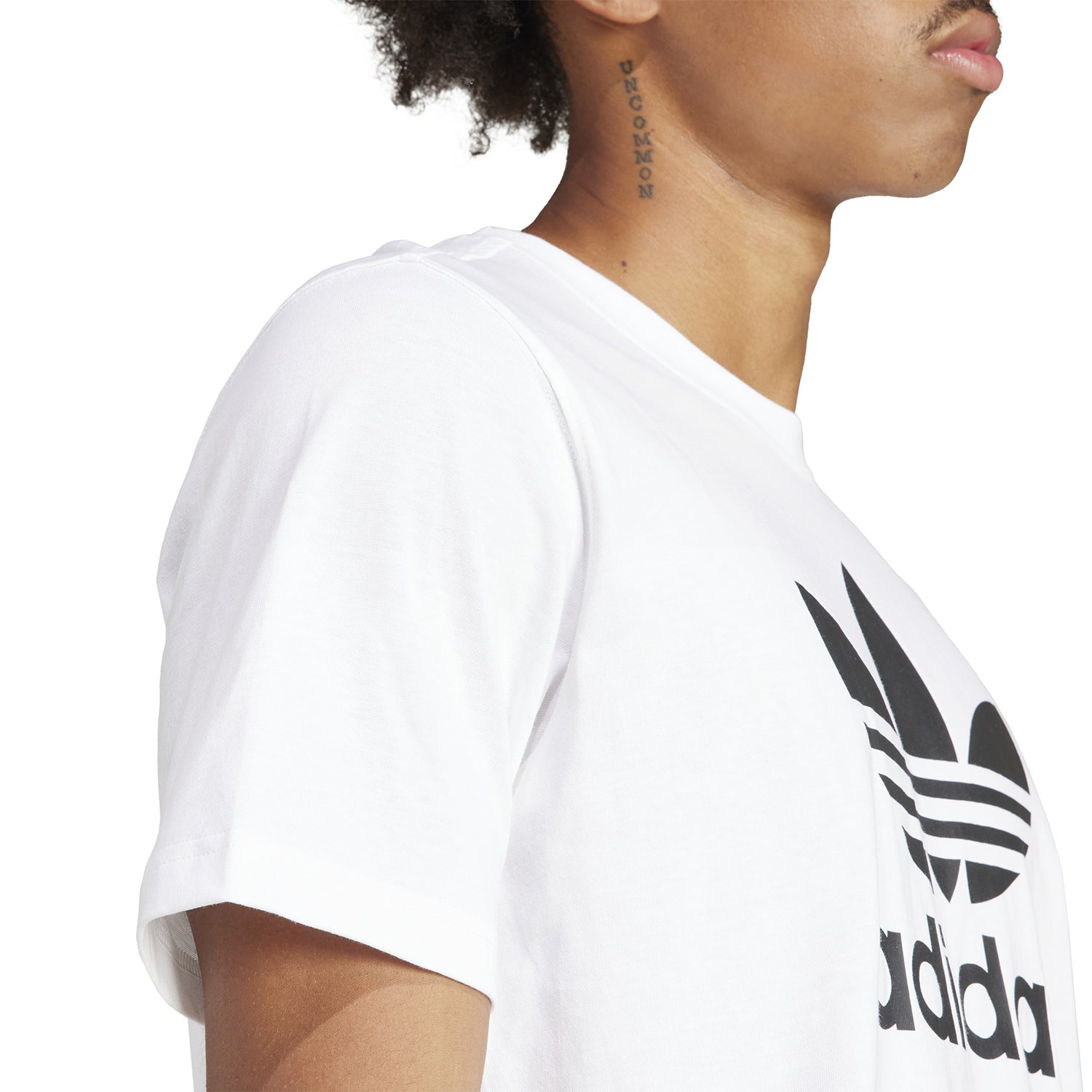 Side view of the mens everyday comfort t-shirt, demonstrating its ribbed crewneck and short sleeves.