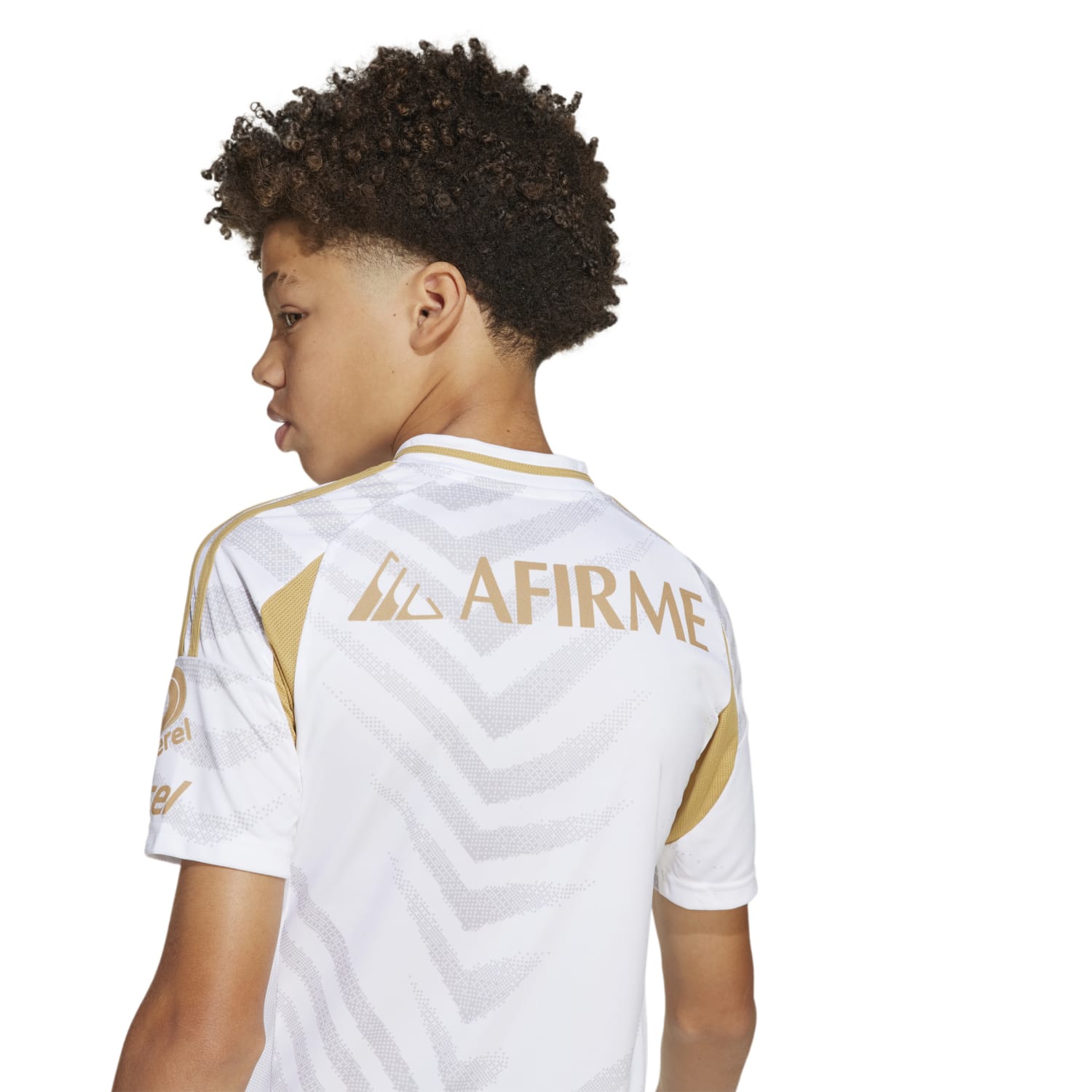 Kid running on the field in a kids football jersey with moisture-wicking fabric