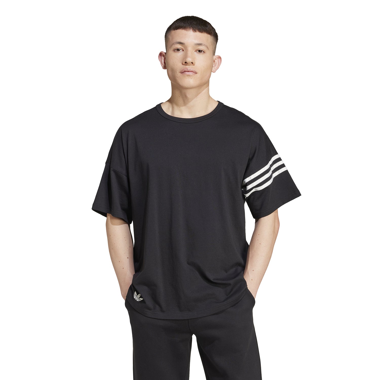 Close-up of the Adidas Neu Classics tee, highlighting the striped sleeve design and Trefoil logo.
