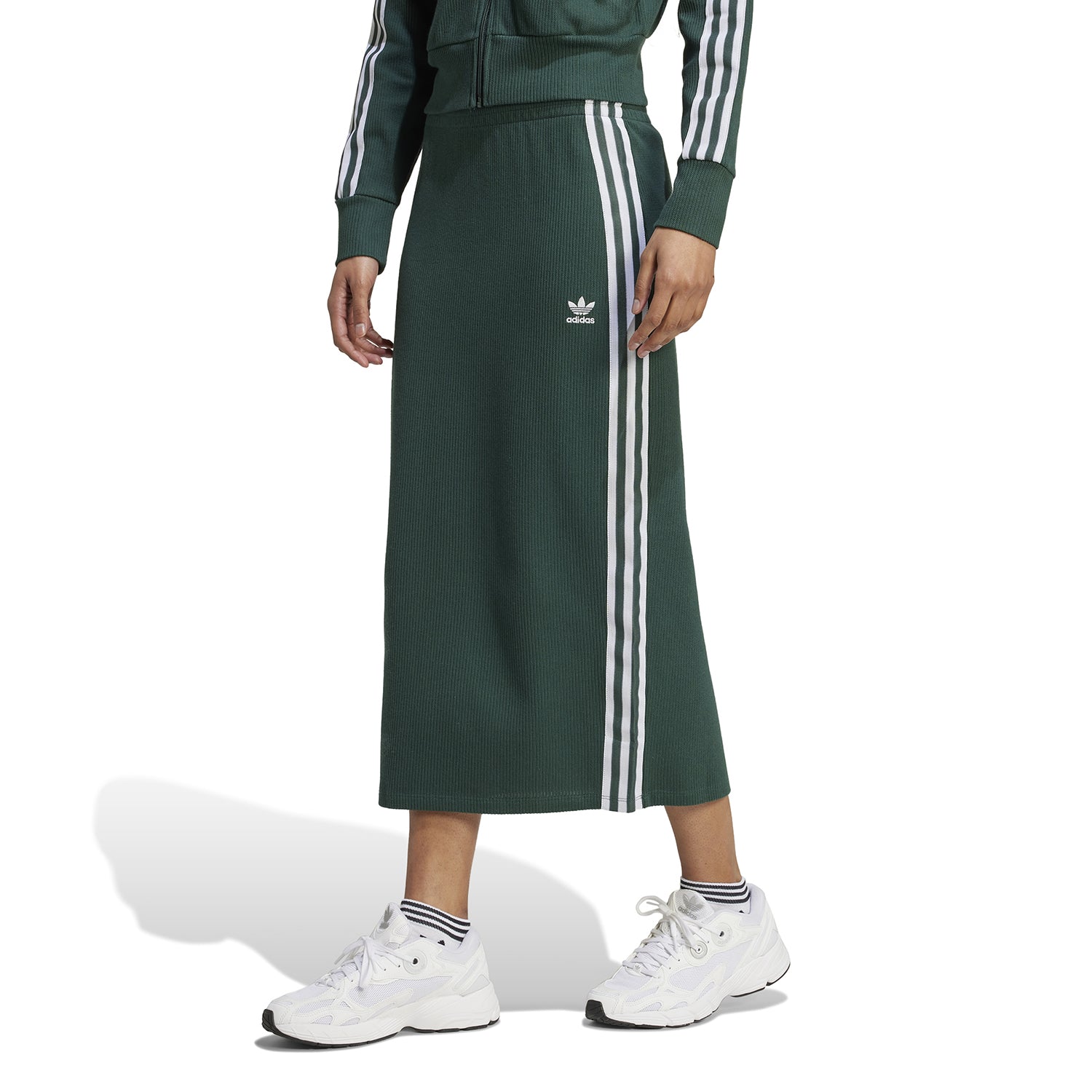 Close-up of the elastic waistband and iconic three-stripe detail on the adidas skirt