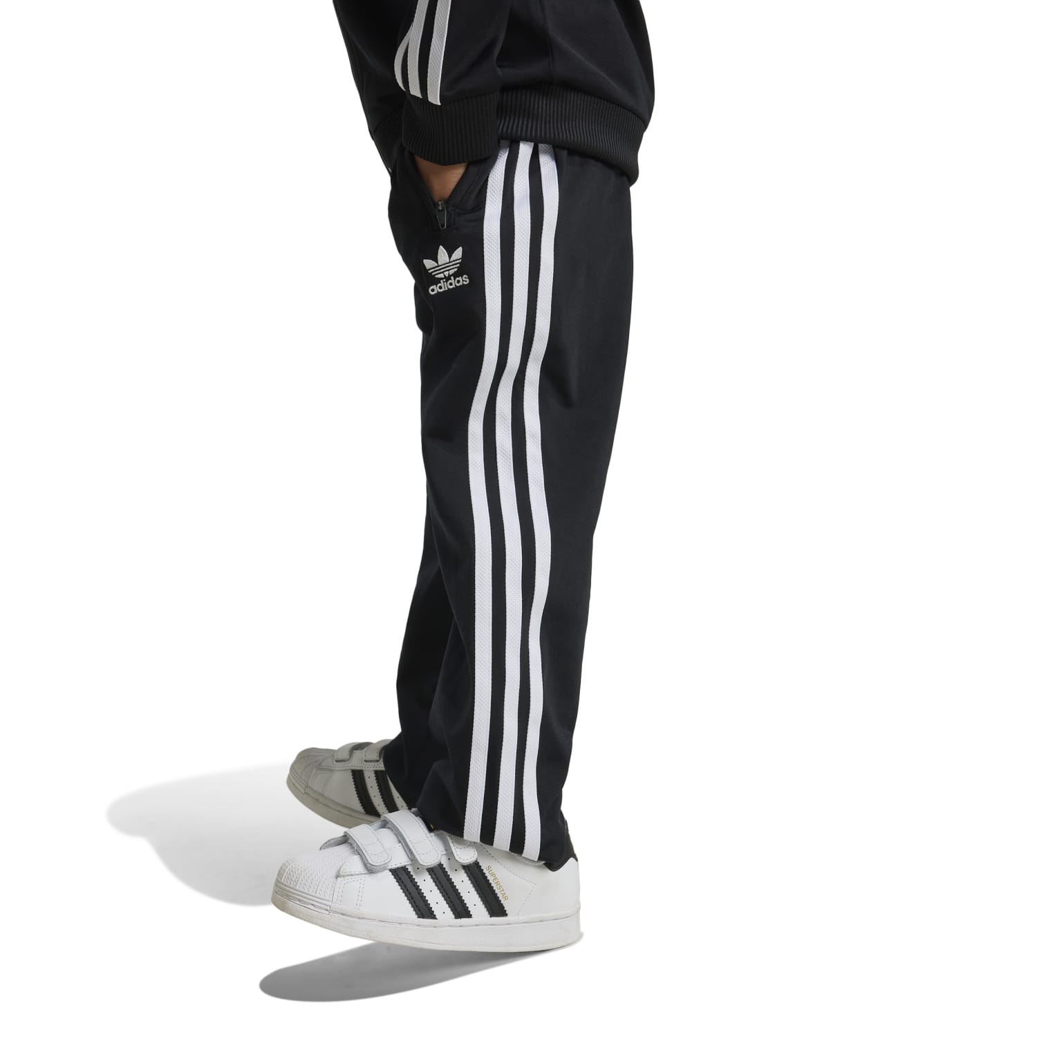 Adidas Kids Track Set featuring elastic waistband and side pockets, perfect for playtime.