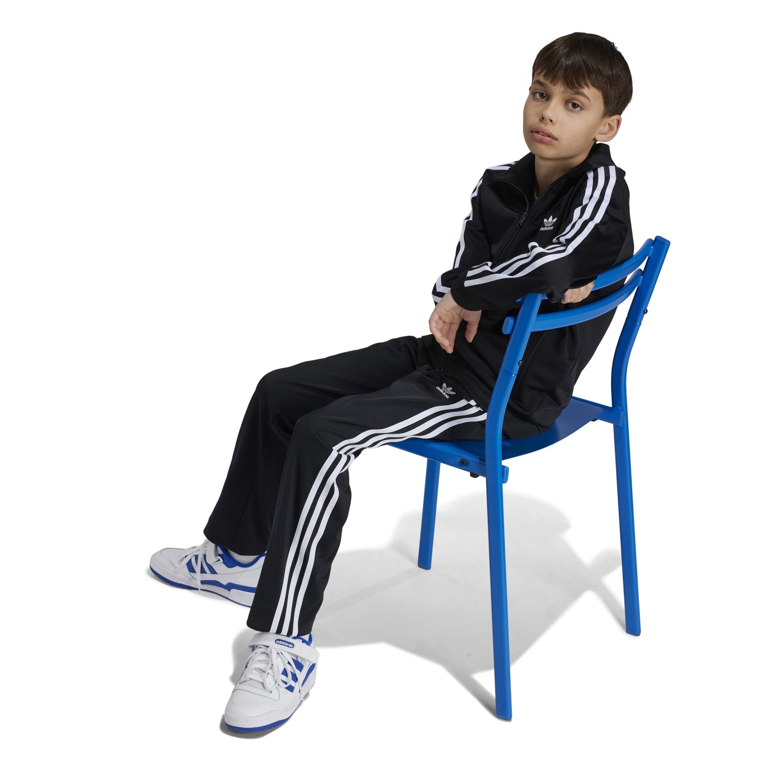Back view of the track jacket, featuring iconic three-stripe detailing.