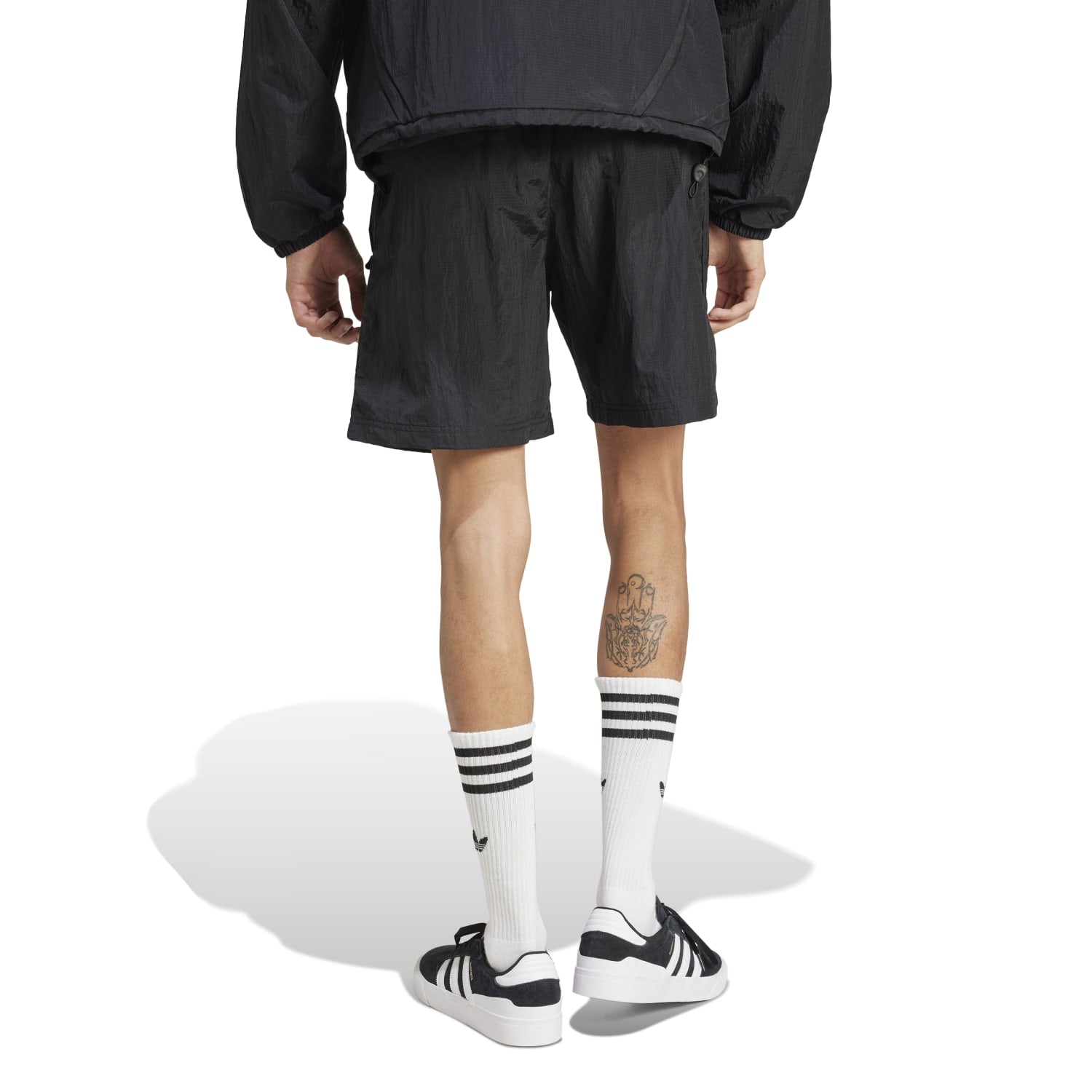 Back view of Adicolor 2000s shorts, highlighting the retro design and fit.