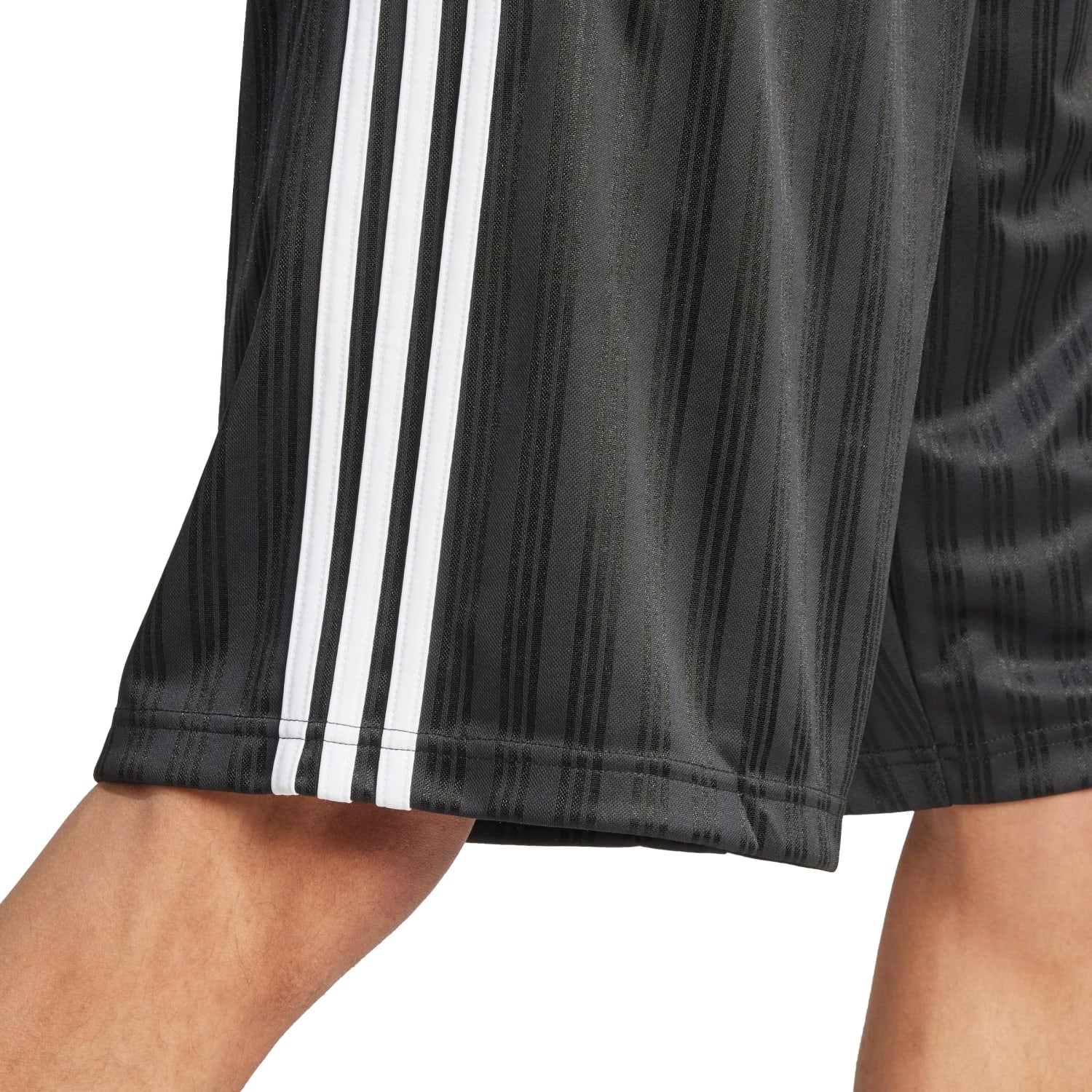 Side view showcasing the jacquard pattern of mens performance shorts during a run