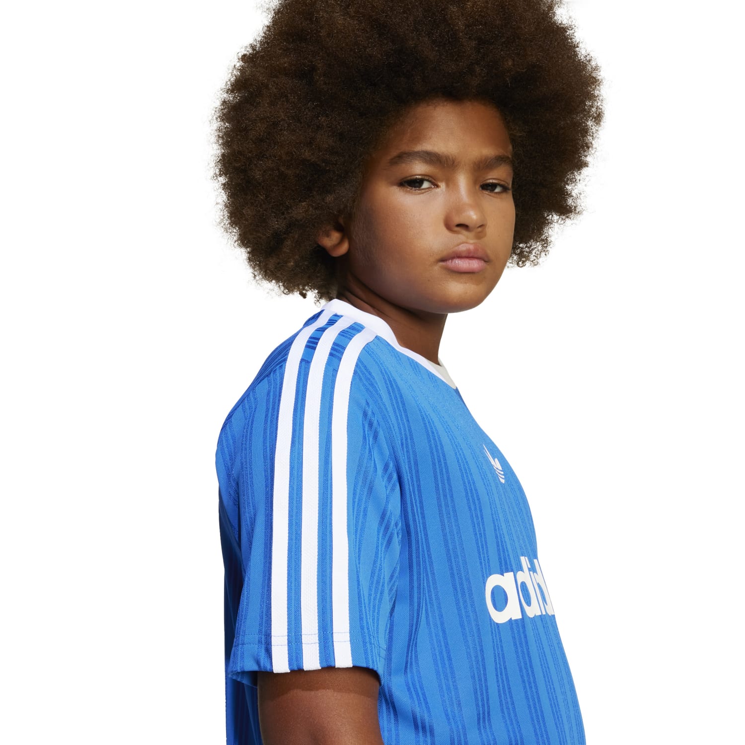 Young player wearing a cheap youth soccer jersey with logo